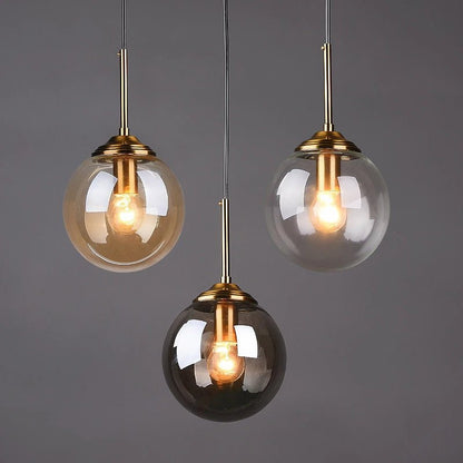 LumiSfera – lampada a sospensione in vetro e metallo dorato di Luximode