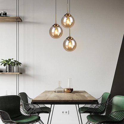 LumiSfera – lampada a sospensione in vetro e metallo dorato di Luximode