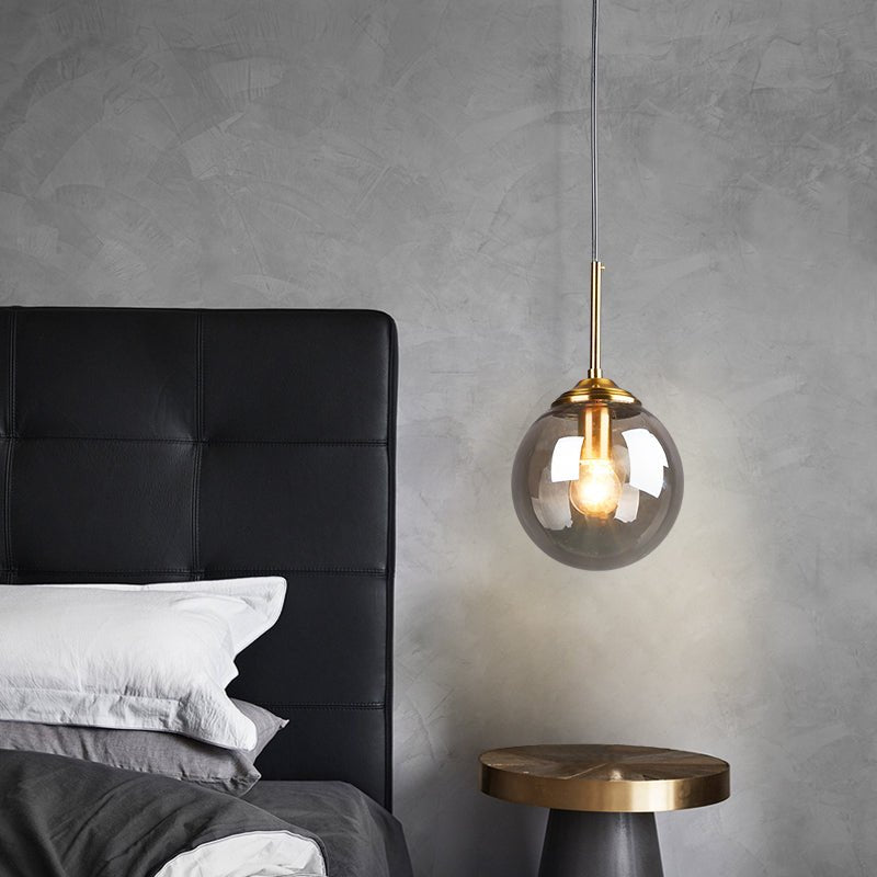 LumiSfera – lampada a sospensione in vetro e metallo dorato di Luximode