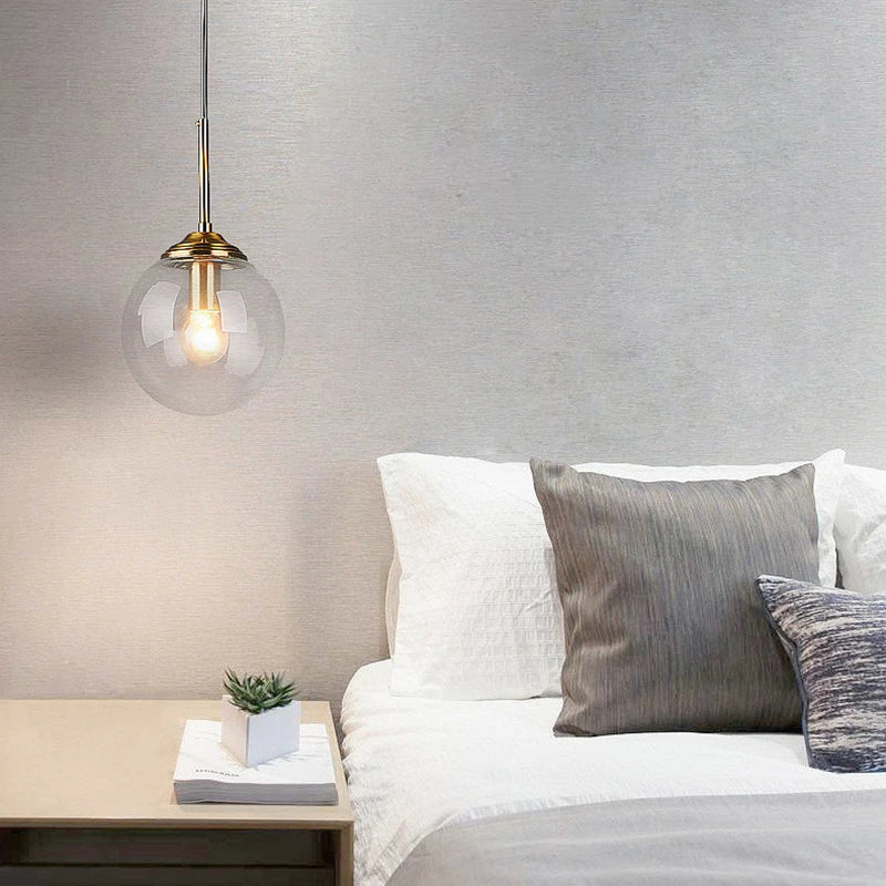 LumiSfera – lampada a sospensione in vetro e metallo dorato di Luximode