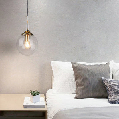 LumiSfera – lampada a sospensione in vetro e metallo dorato di Luximode