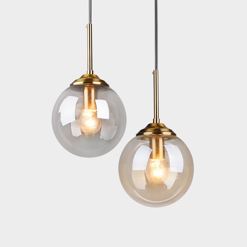LumiSfera – lampada a sospensione in vetro e metallo dorato di Luximode