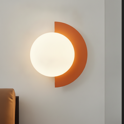 TondoVivo arancione accanto alla testata del letto | Luximode