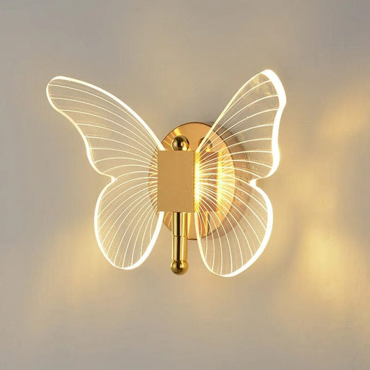 Applique WingLow a forma di farfalla accesa, ali in acrilico e base oro